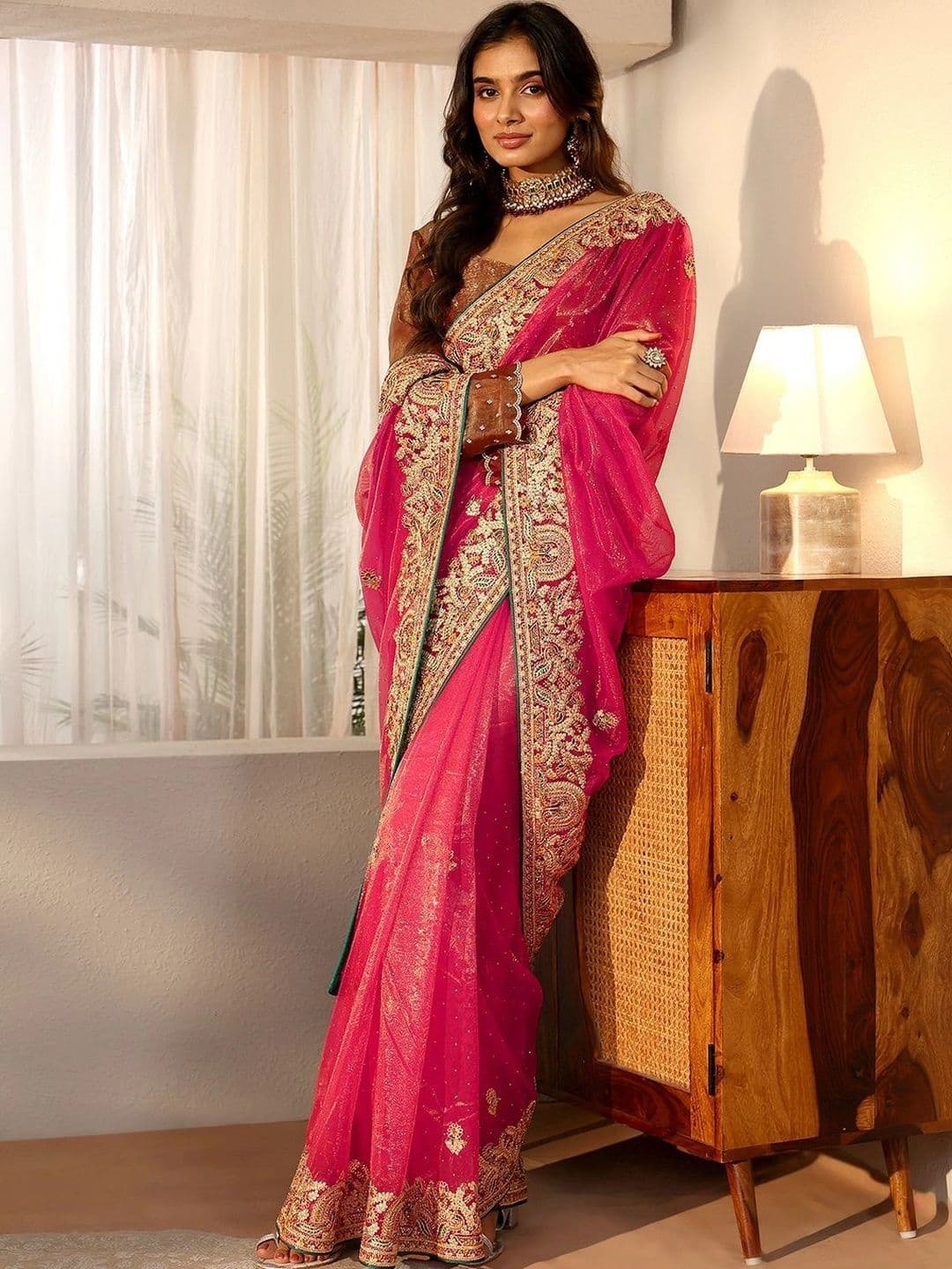 Floral Net Saree Libas Peach Net Saree with Embroidered Border
