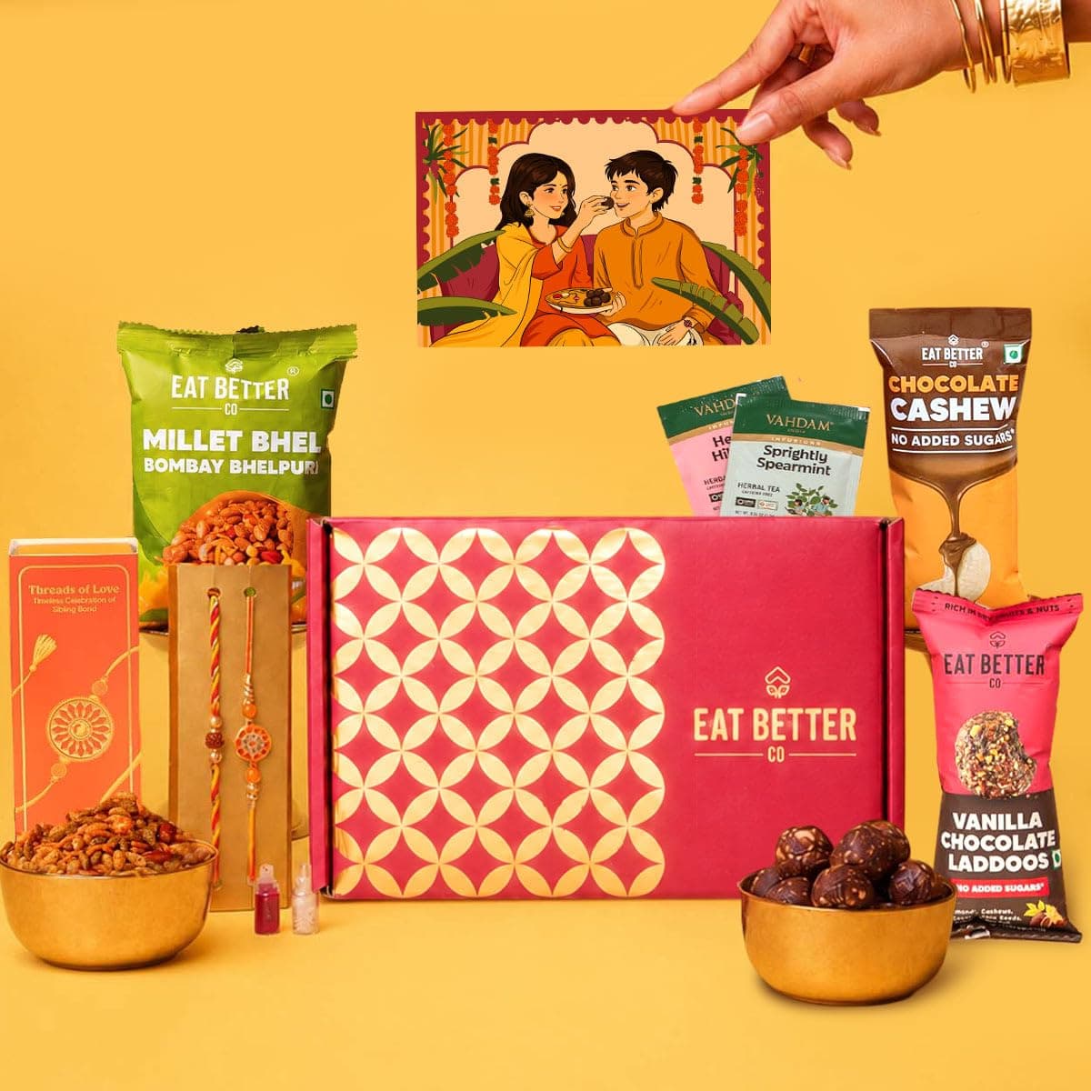 Eat Better Co - Anmol - 9-Item Rakhi Gift Hamper with Set of 2 Rakhis - Chocolate Coated Nuts, Dry-Fruit Laddoos & more, Raksha Bandhan gift for Brother - 2 Rakhi with Gift Set