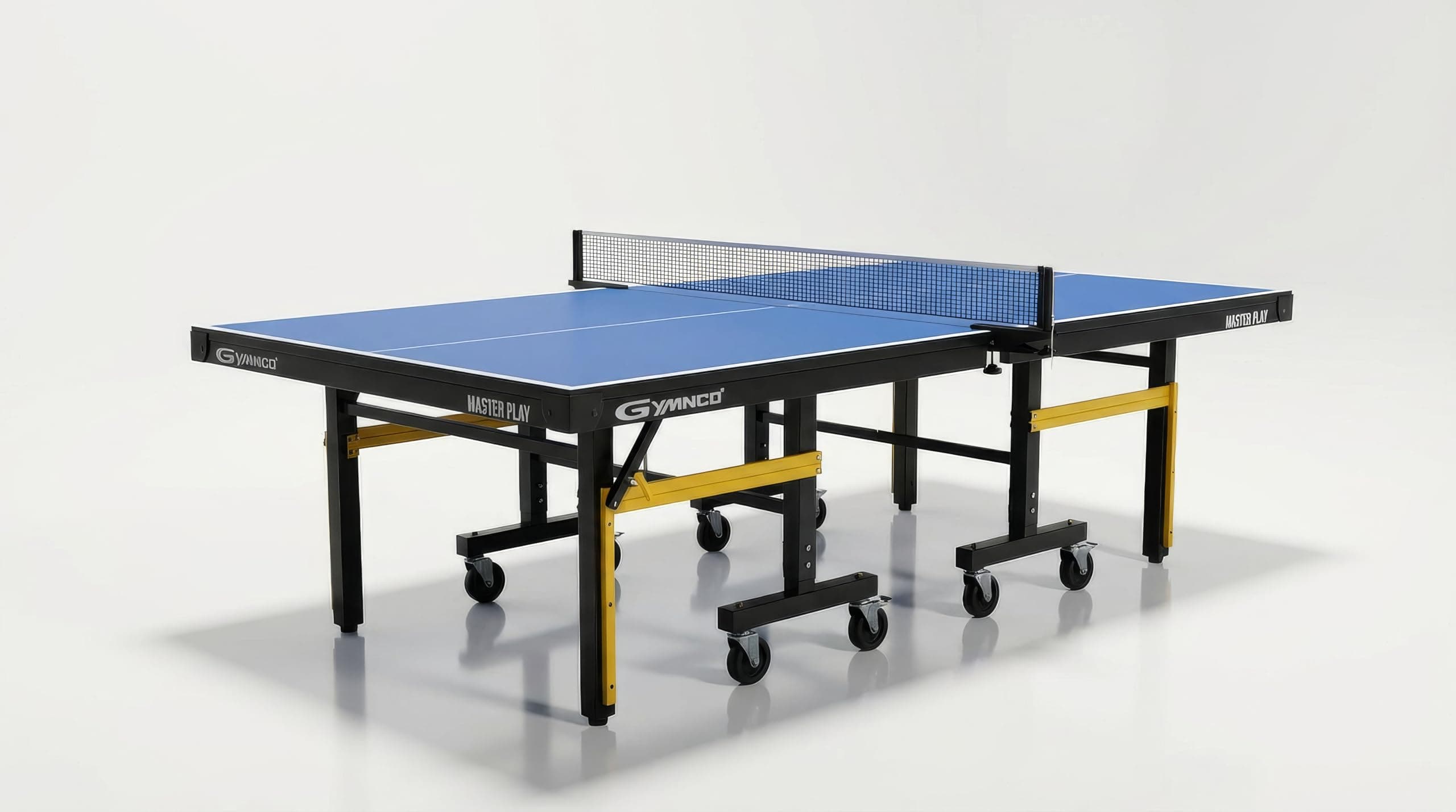 Gymnco Master Play Board Thickness 25 MM E-1 Grade Table Tennis Table with Wheel (UV TECH Special Compressed Laminated Board 25 mm) (Free TT Table Cover + 2 TT Racket & 1 Balls)