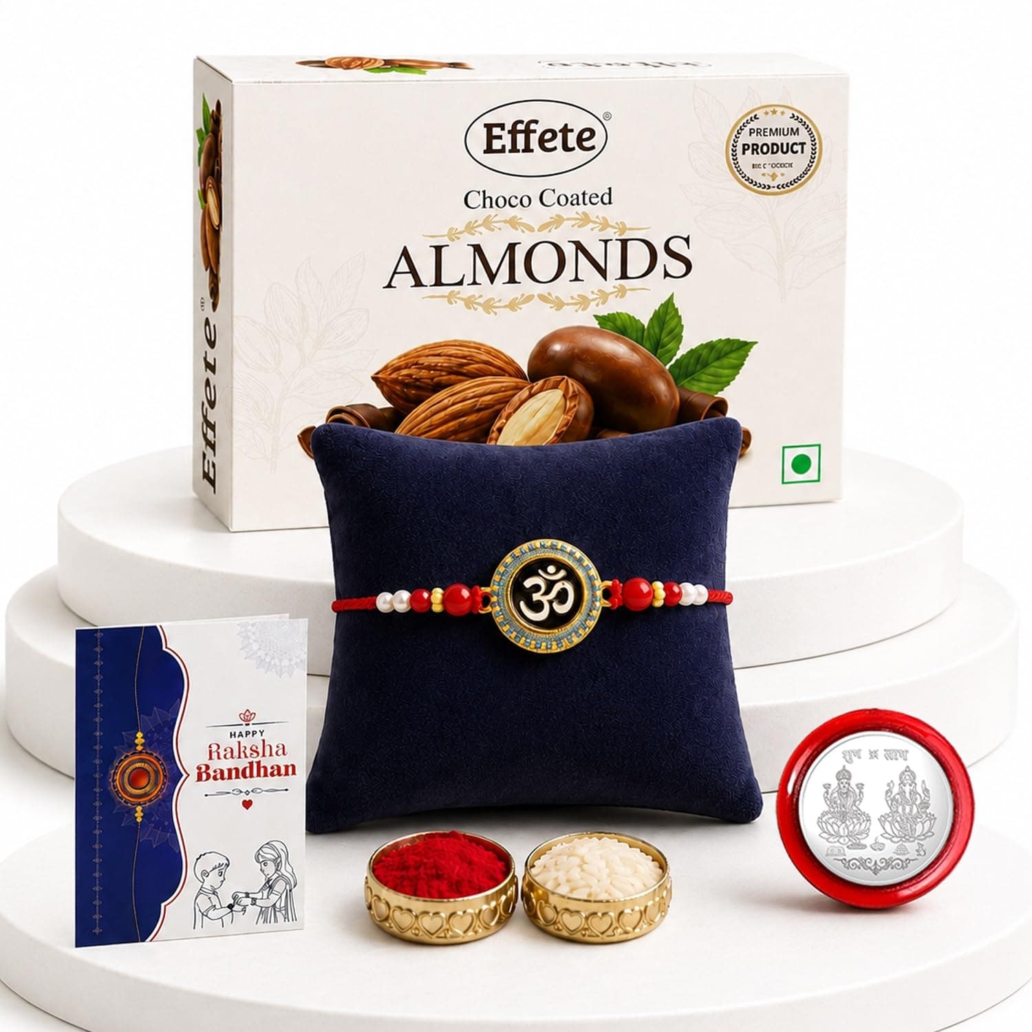 DeoDap Chocolate with Rakhi Set for Brother – OM Design Round Shape Colorful Rakhi with Choco Almonds (32 GM), Silver Color Pooja Coin & Greeting Card – Tradtional Raksha Bandhan Celebration Combo